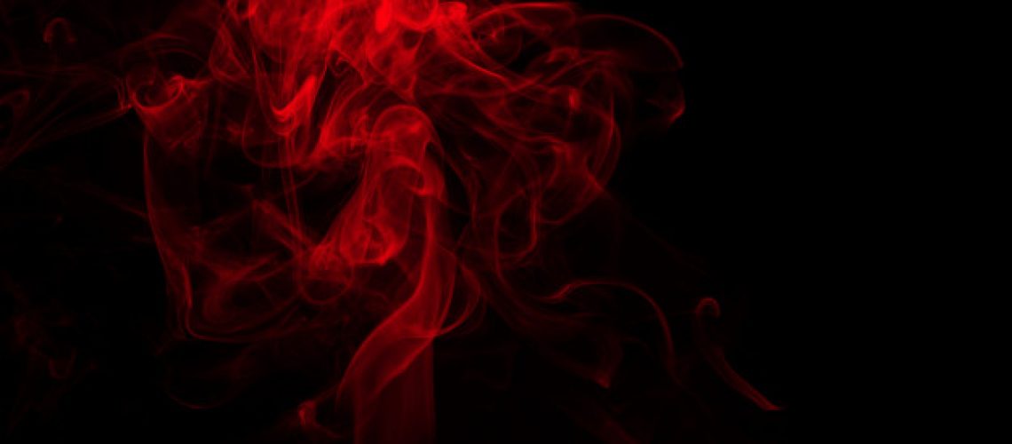 fluffy-puffs-red-smoke-fog-black-background-fire-darkness-concept_55716-2694